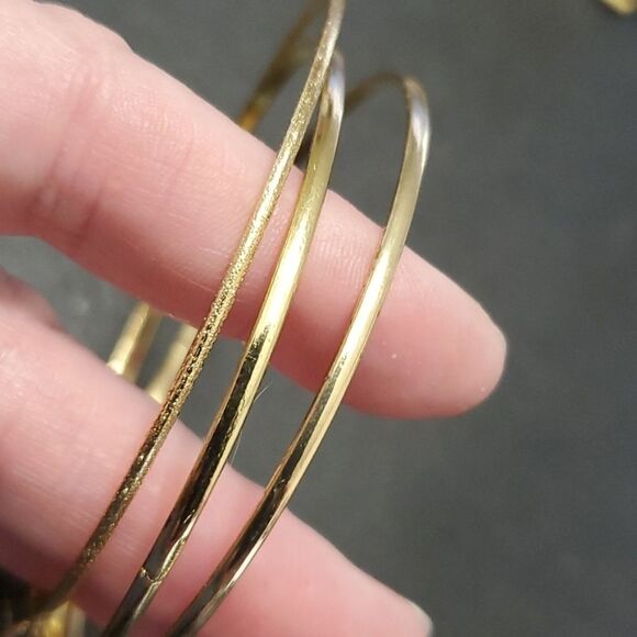 Gold tone layered bracelet with charms - Picture 5 of 9